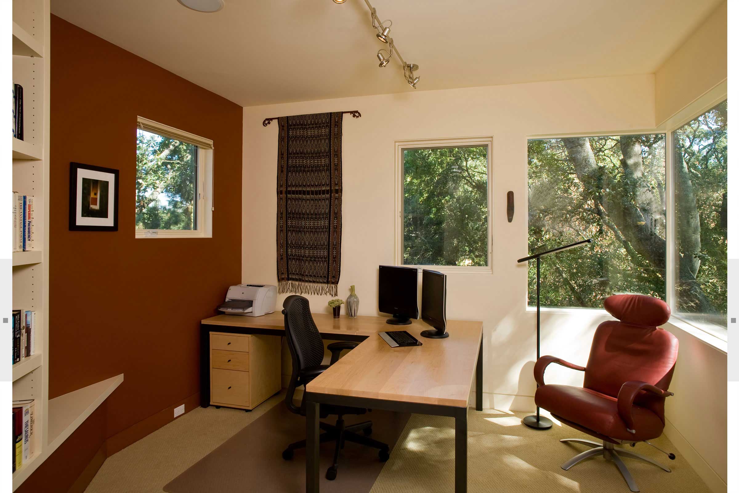 office with ell shaped desk and bookshelves