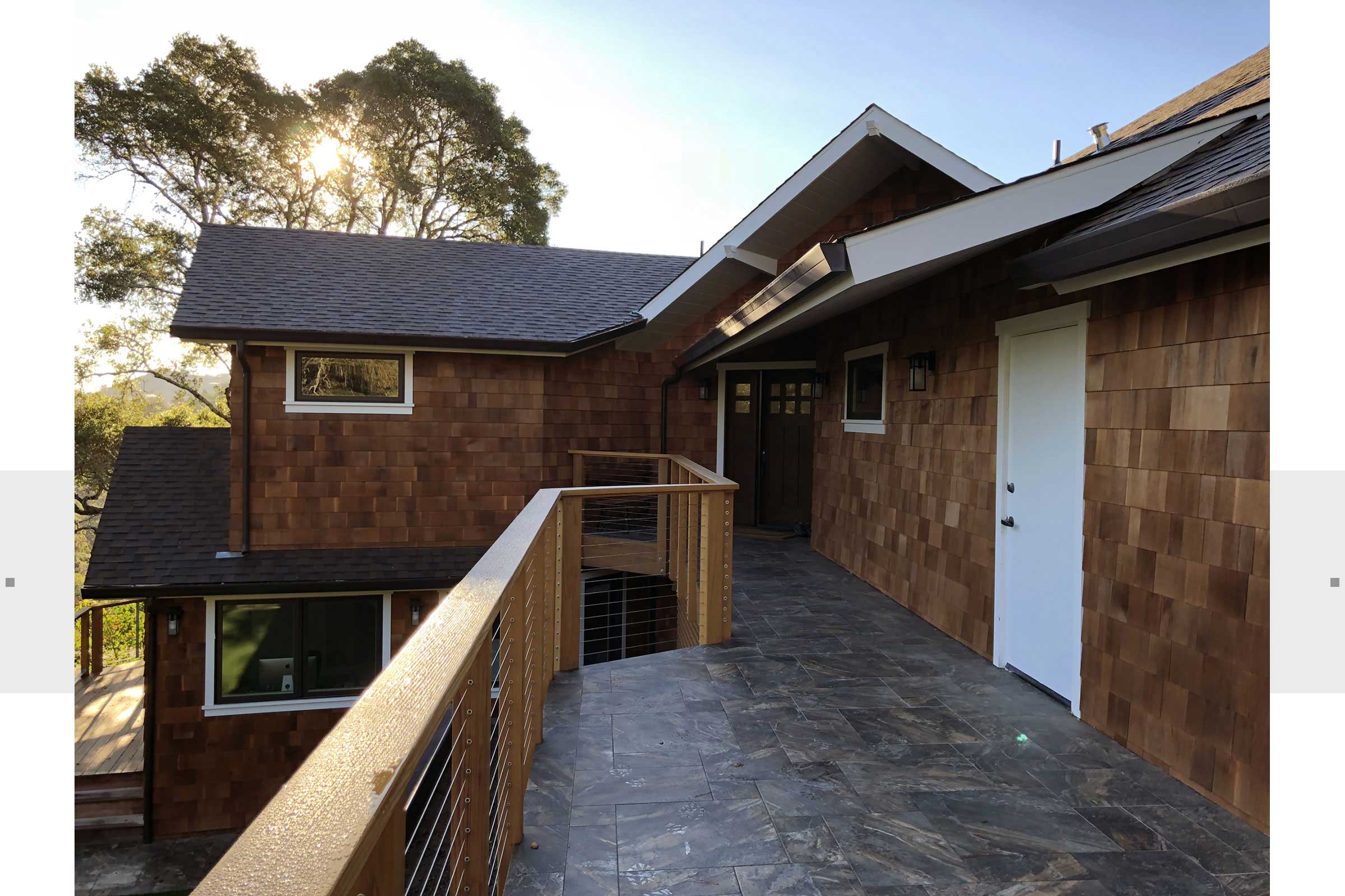 exterior view of cedar shingled home and porch