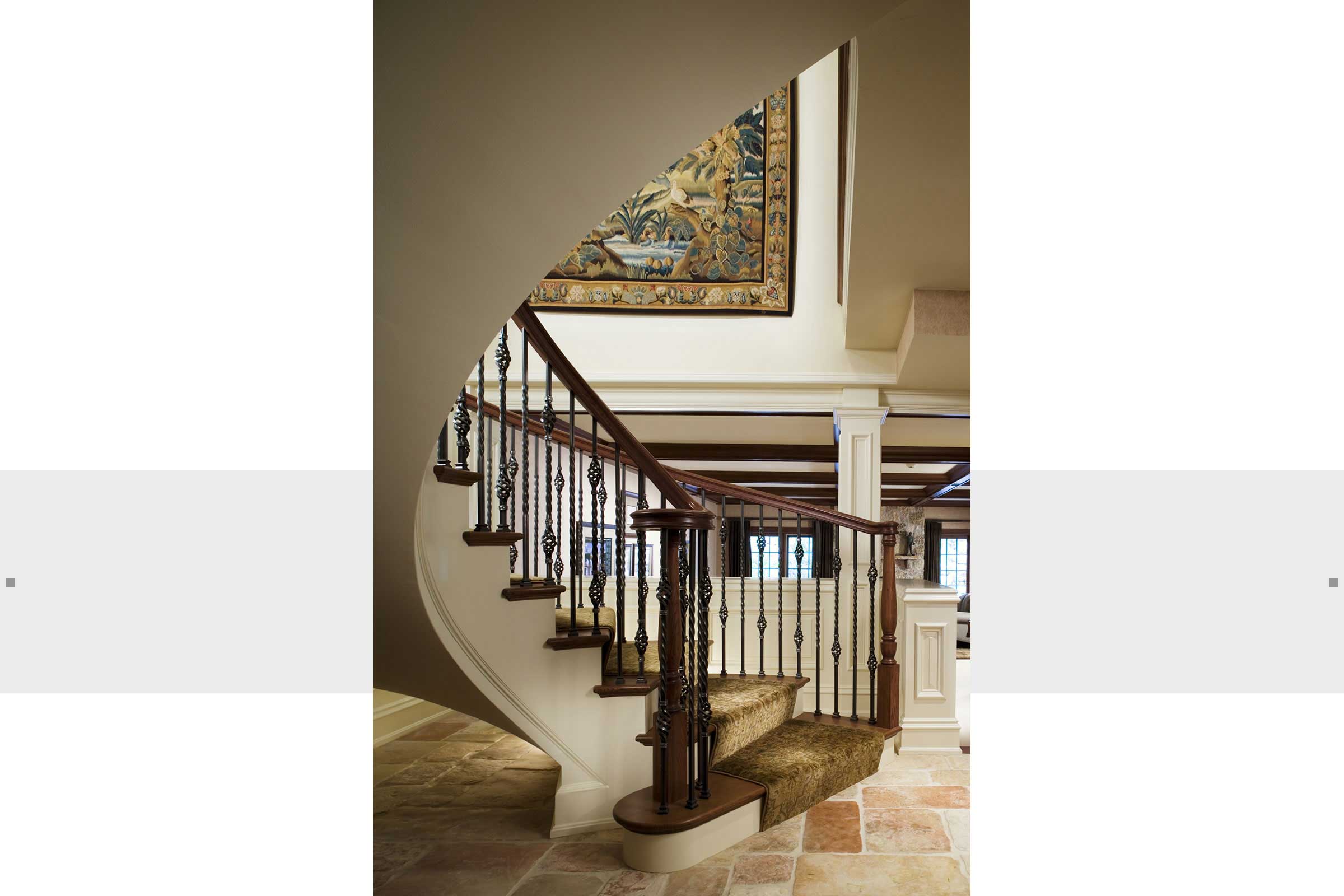 formal staircase into foyer of home