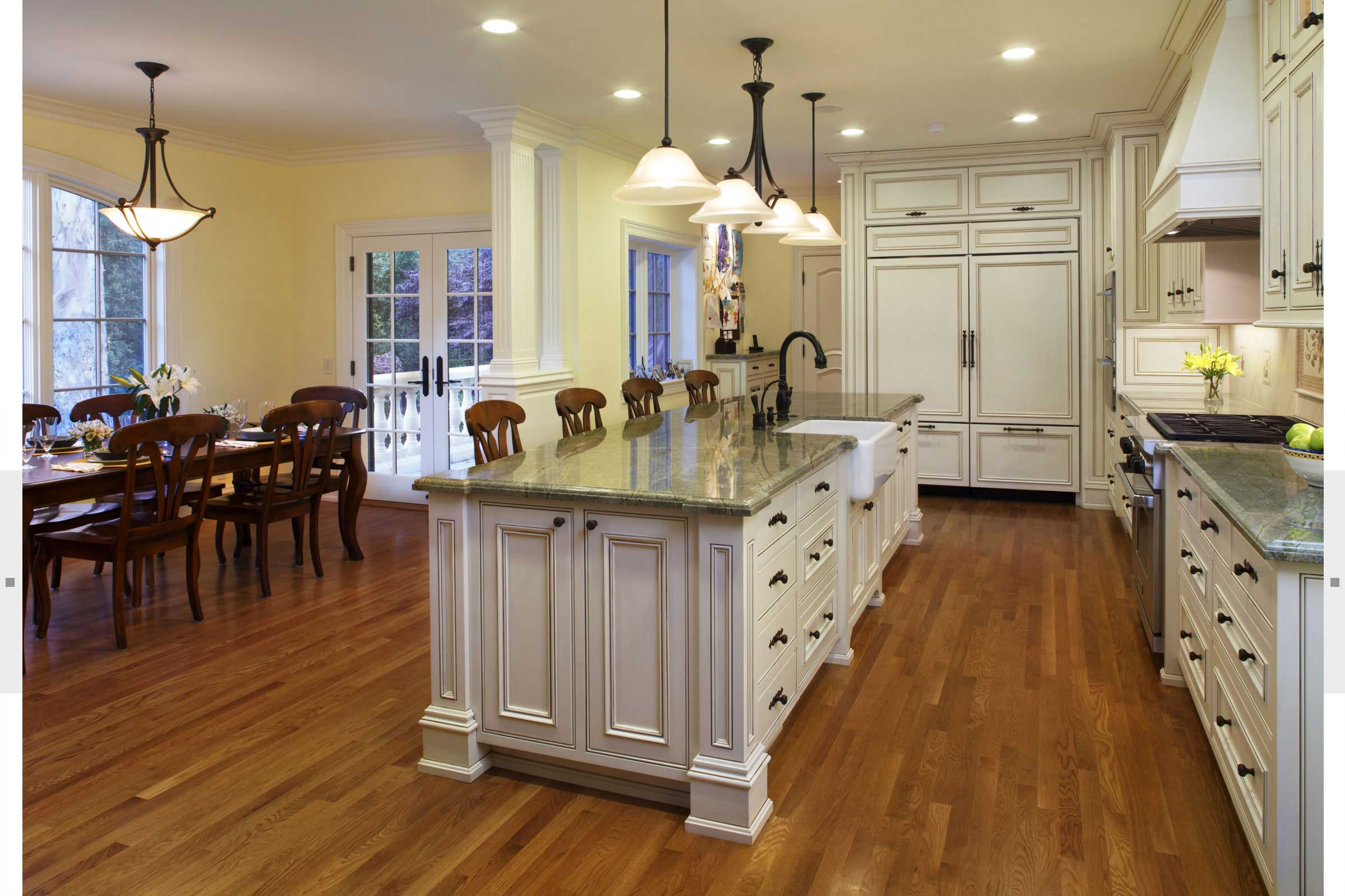 white kitchen with island seating for prep and dining