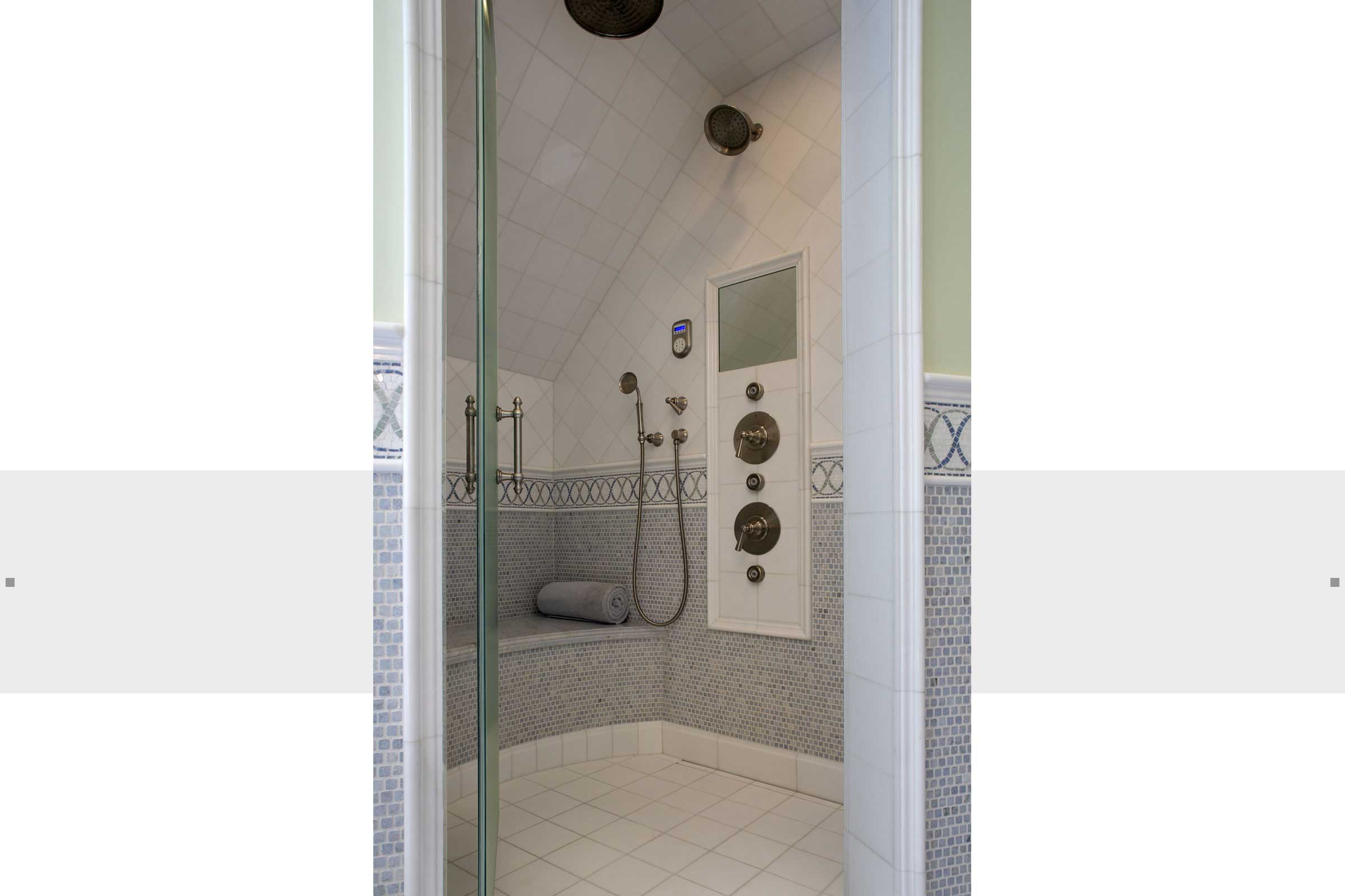 bathroom with large walk in shower and custom design