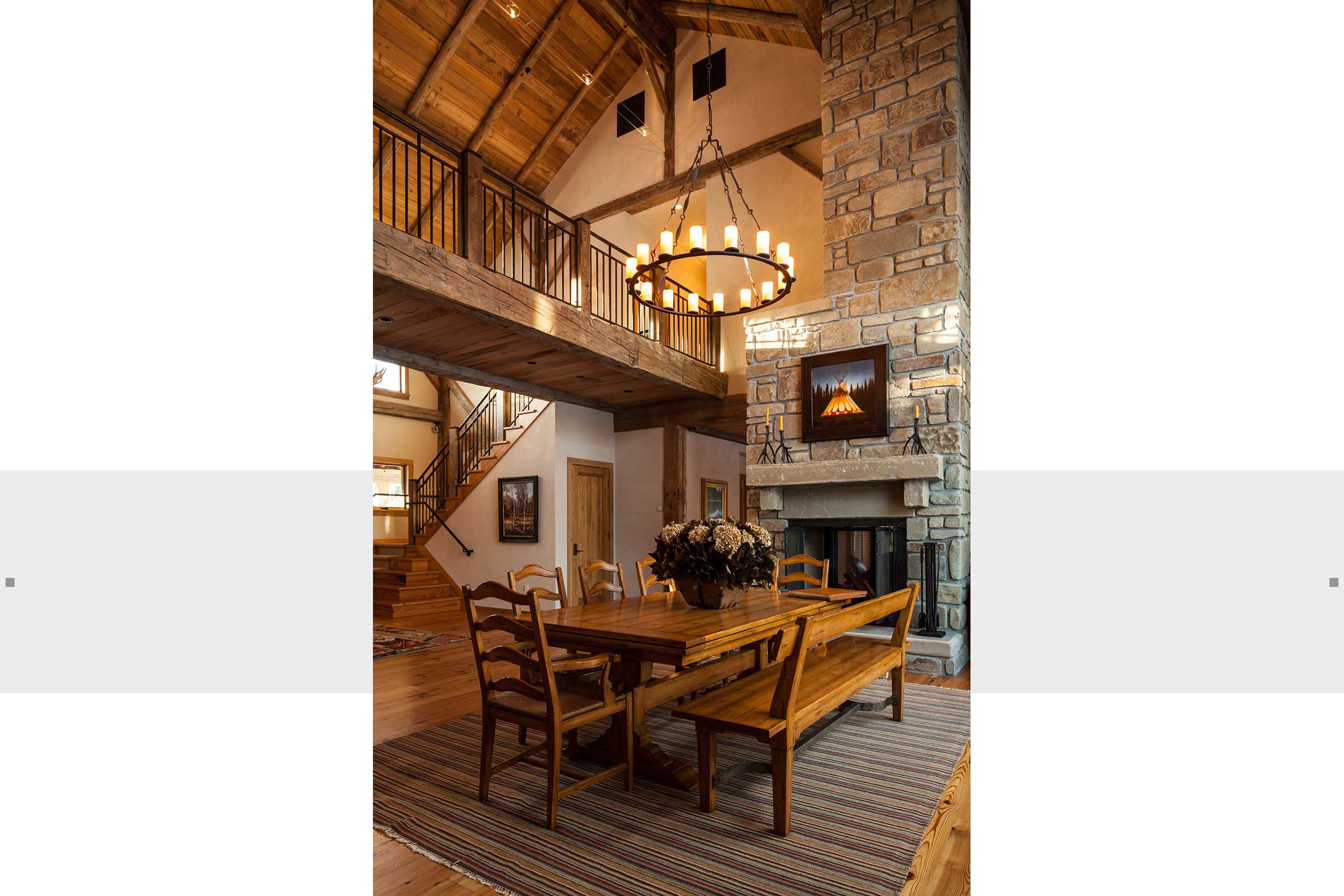 dining area with soaring ceilings and fireplace