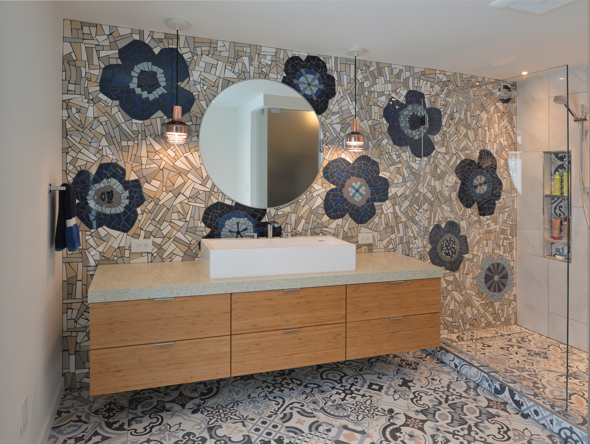 expansive mosaic tile work in bathroom